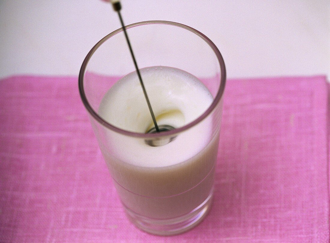Dipping mini-whisk in milk