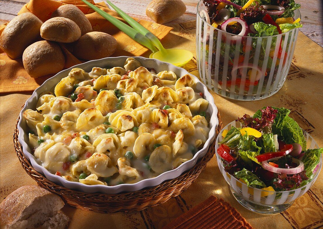Baked tortellini with peas and bacon; salad