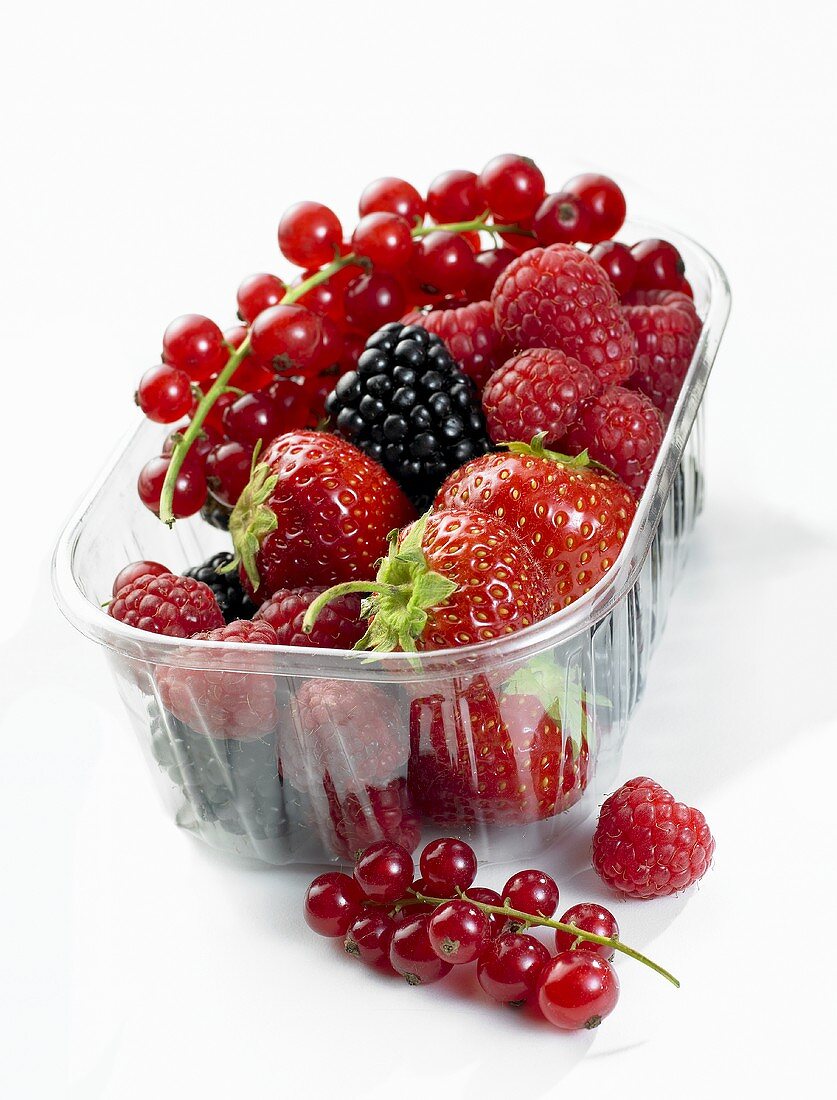 Fresh berries in plastic container