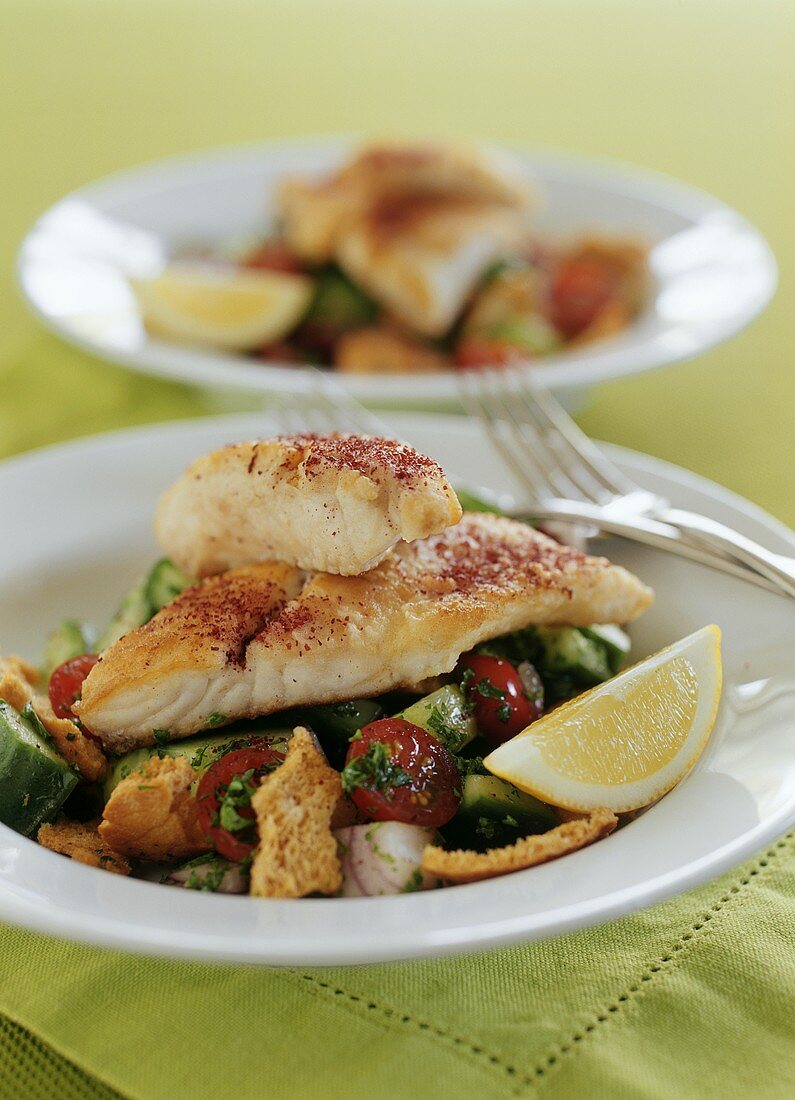 Fried snapper on vegetable salad