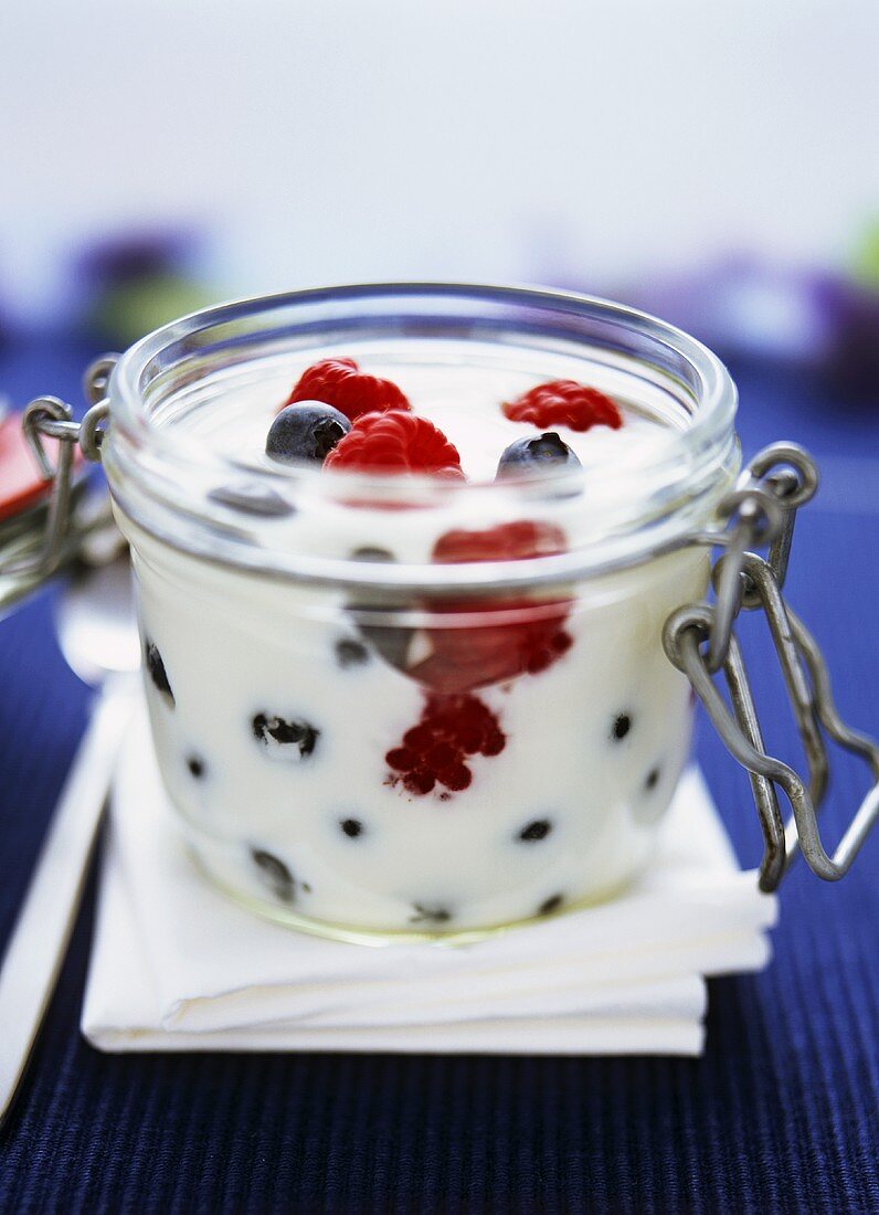 Yoghurt with fresh berries in glass