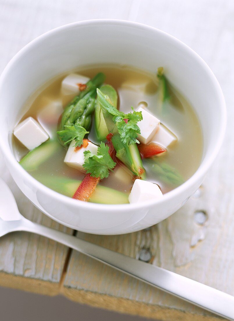 Miso soup with green asparagus, peppers and tofu