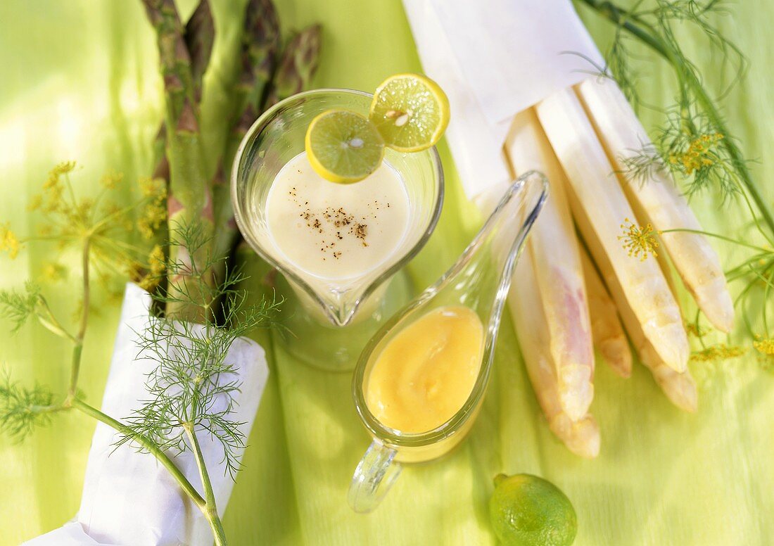 Fresh white and green asparagus with two sauces