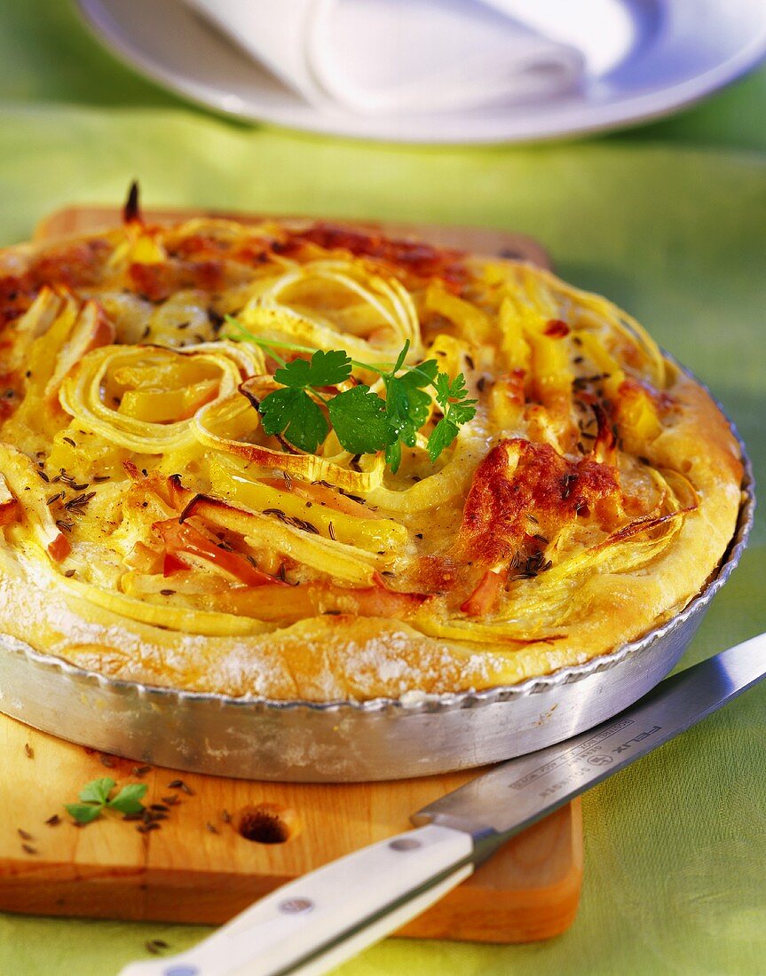 Savoury cheese and potato cake with apples and onions