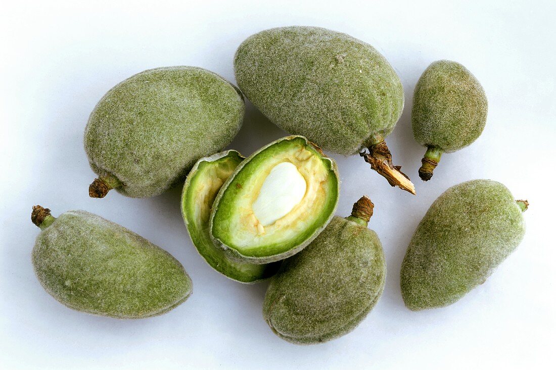 Whole and opened fresh almonds