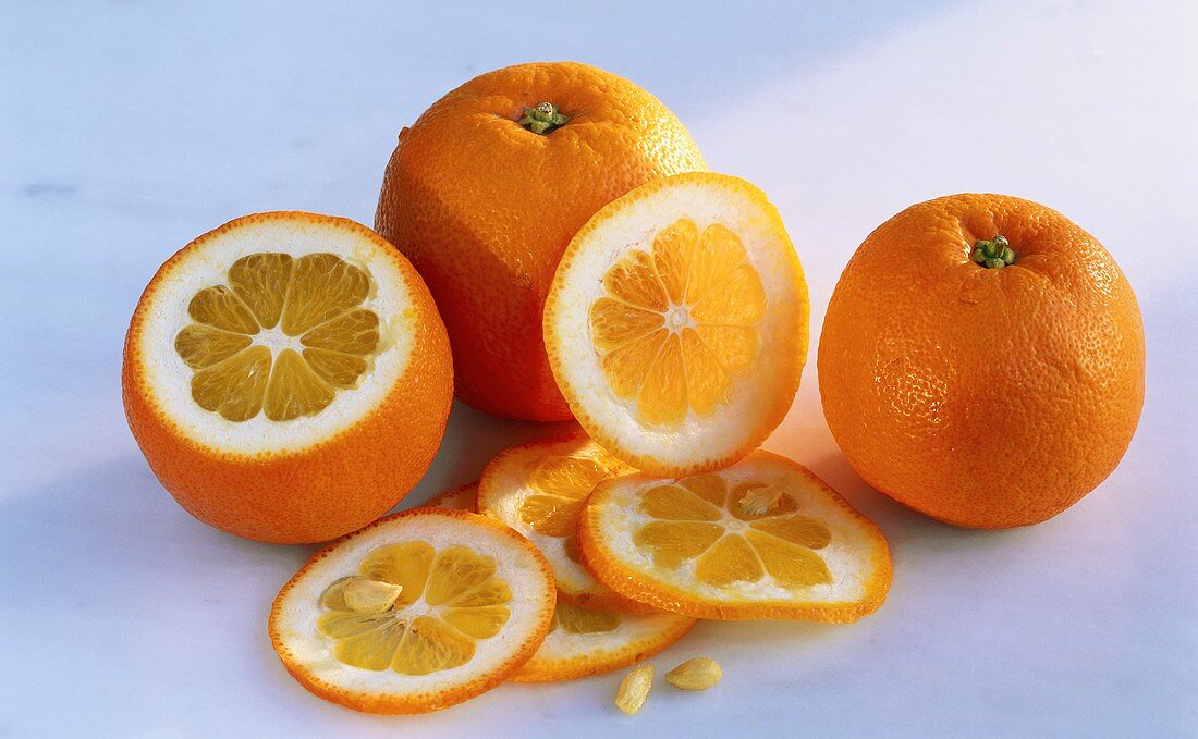 Oranges, whole and cut open, orange slices