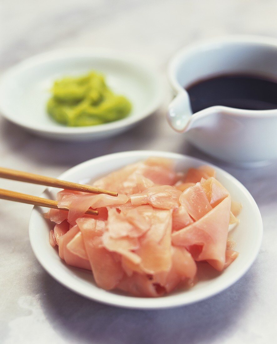 Sushi ingredients: bottled ginger slices, soy sauce and wasabi