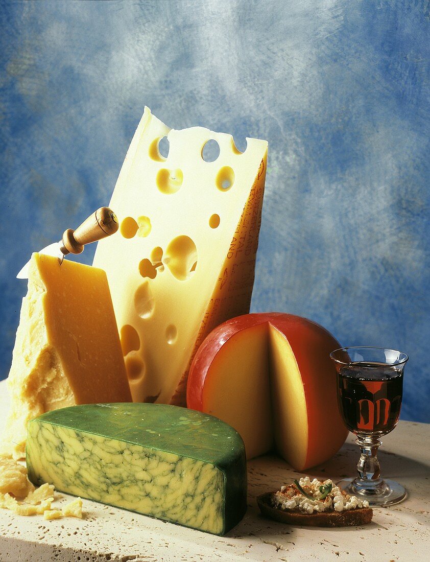 Assorted Types of Cheese with Glass of Wine