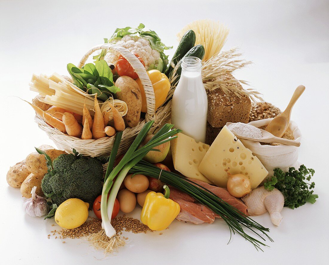 Various foods in and beside basket