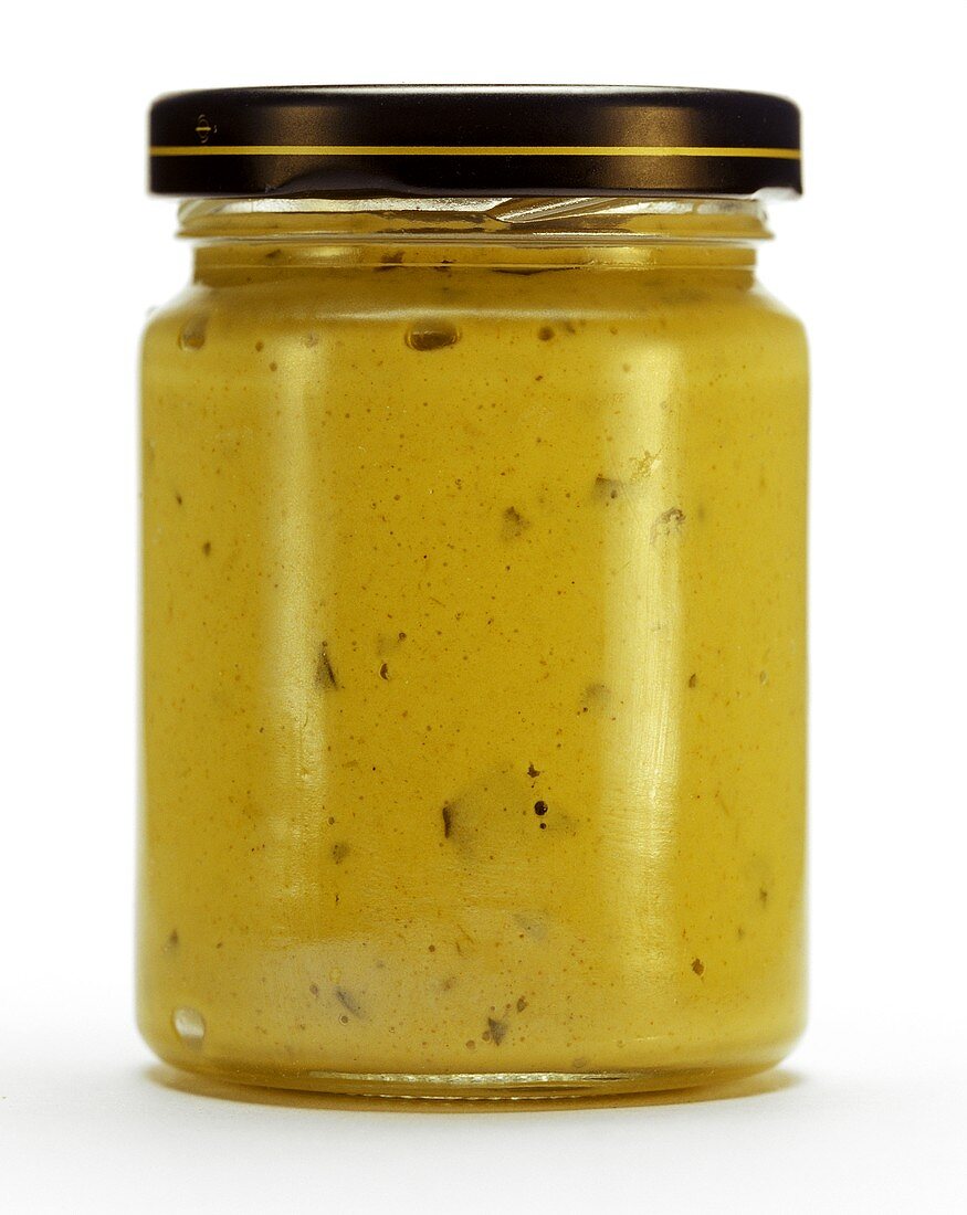 A jar of Dijon mustard with tarragon