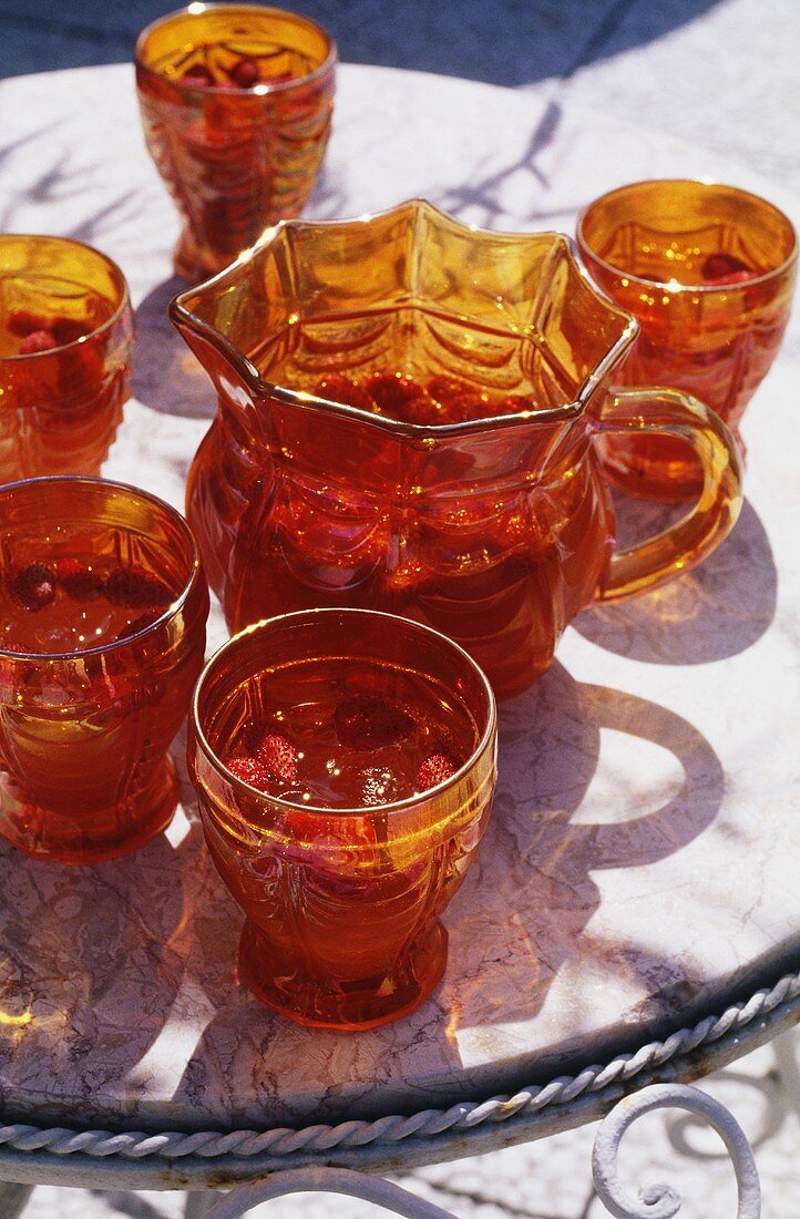 Spanish strawberry punch in glasses and carafe