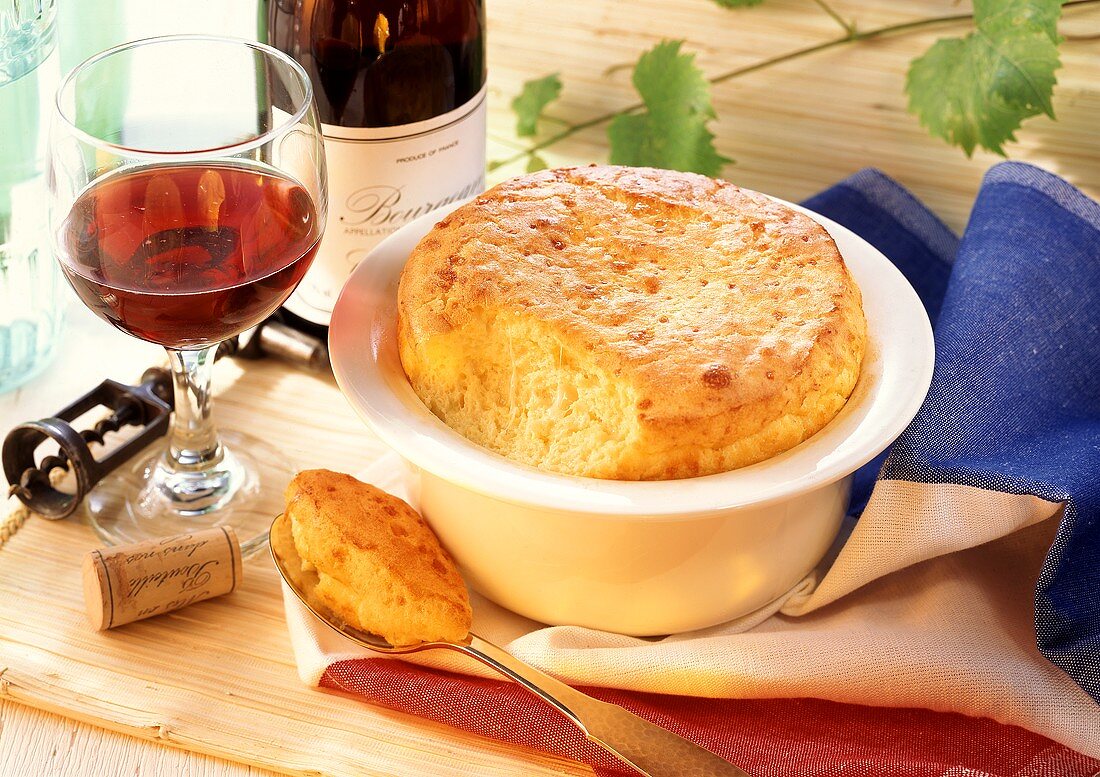 French cheese soufflé in dish and on spoon