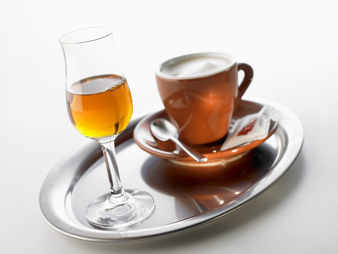 Grappa and espresso on tray