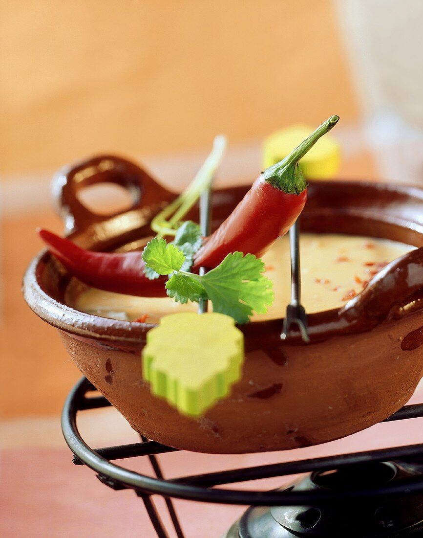 Cheese fondue with Cheddar and chili pepper