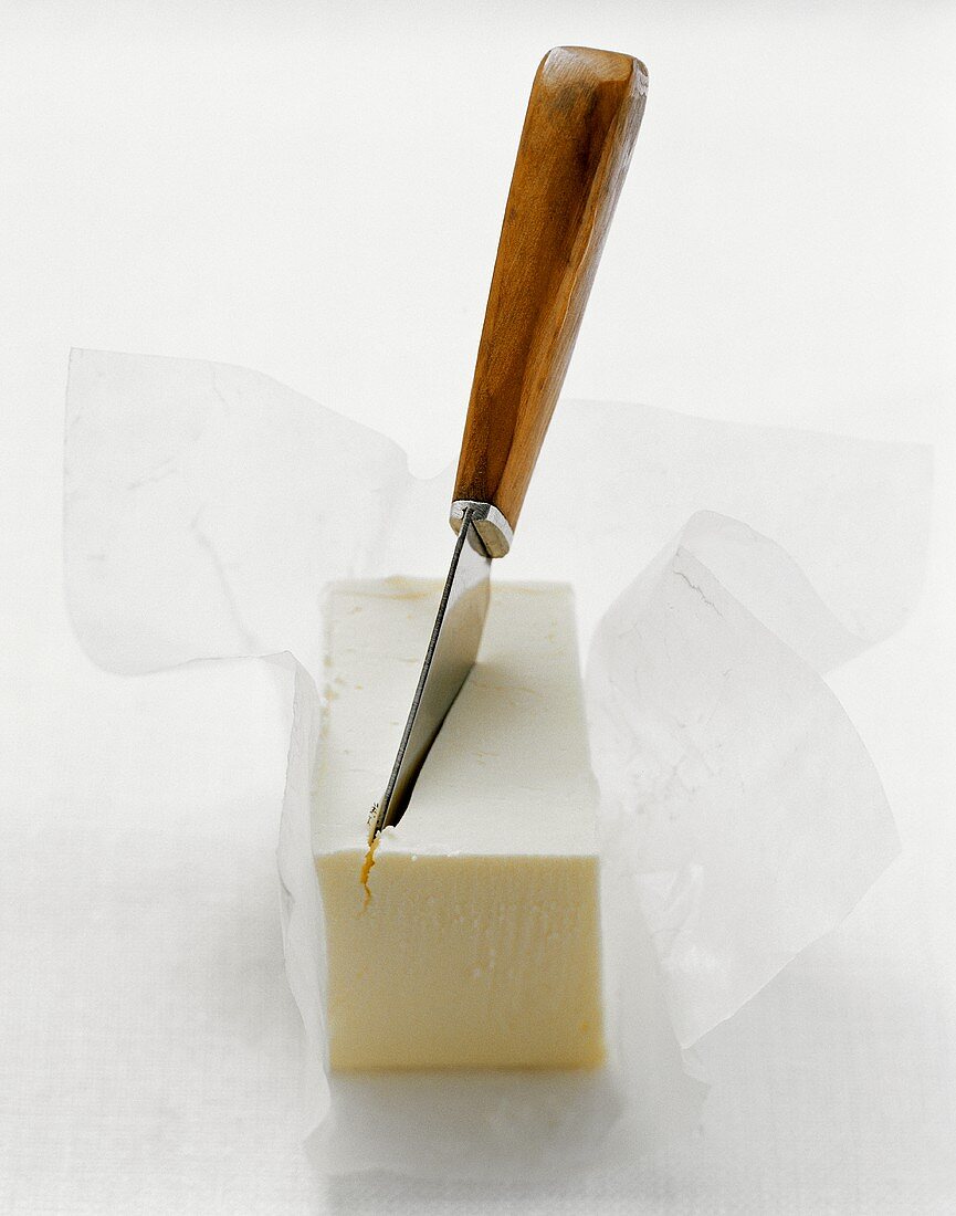 Piece of butter with butter knife