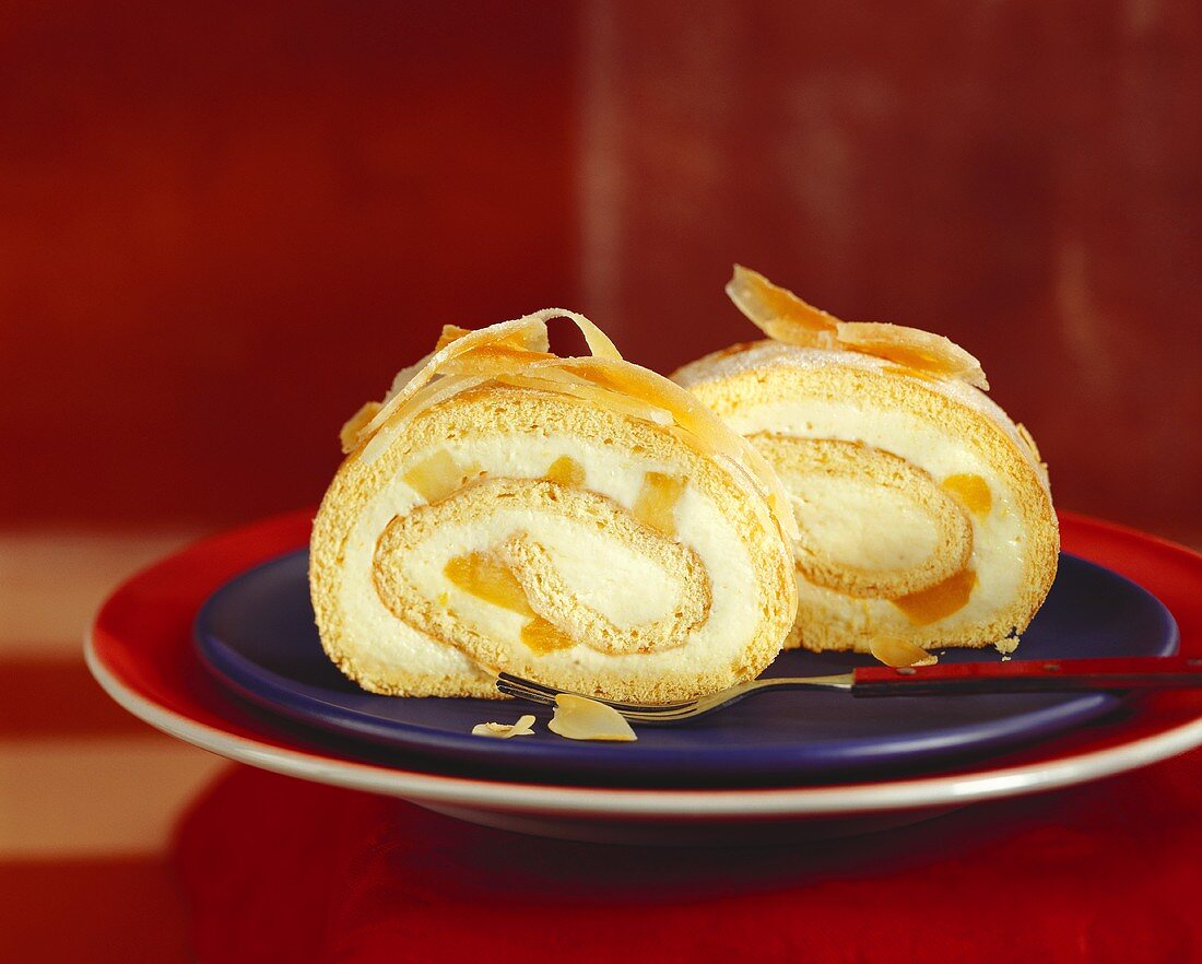 Two slices of sponge roll with mango