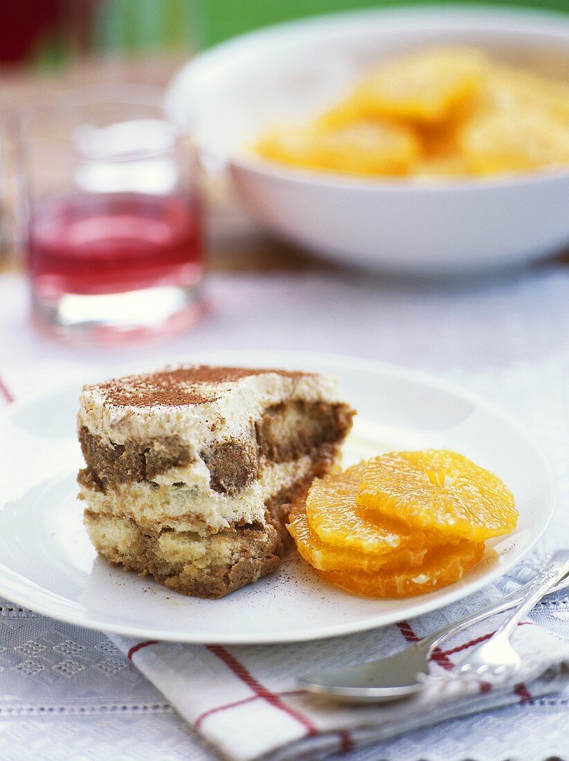 Tiramisu and slices of orange