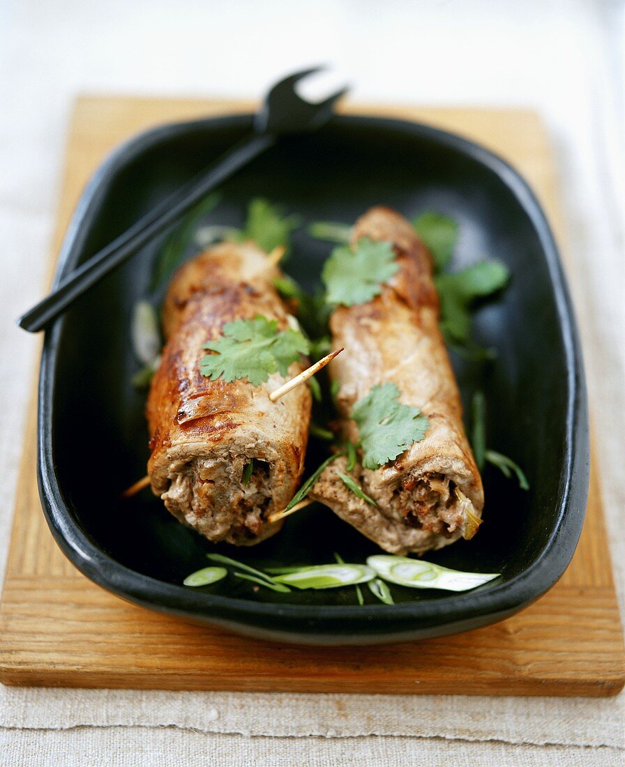 Stuffed veal roulades garnished with coriander leaves