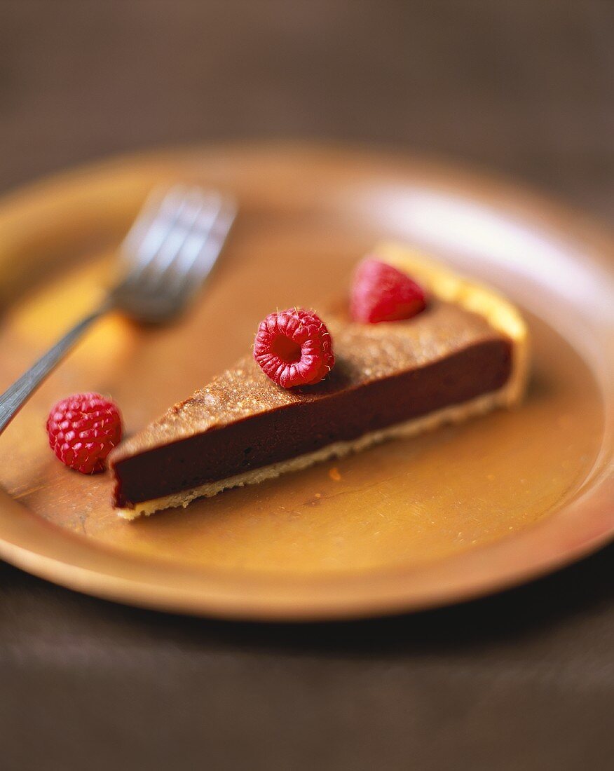 A Slice of Devil's Food Cake with Raspberries