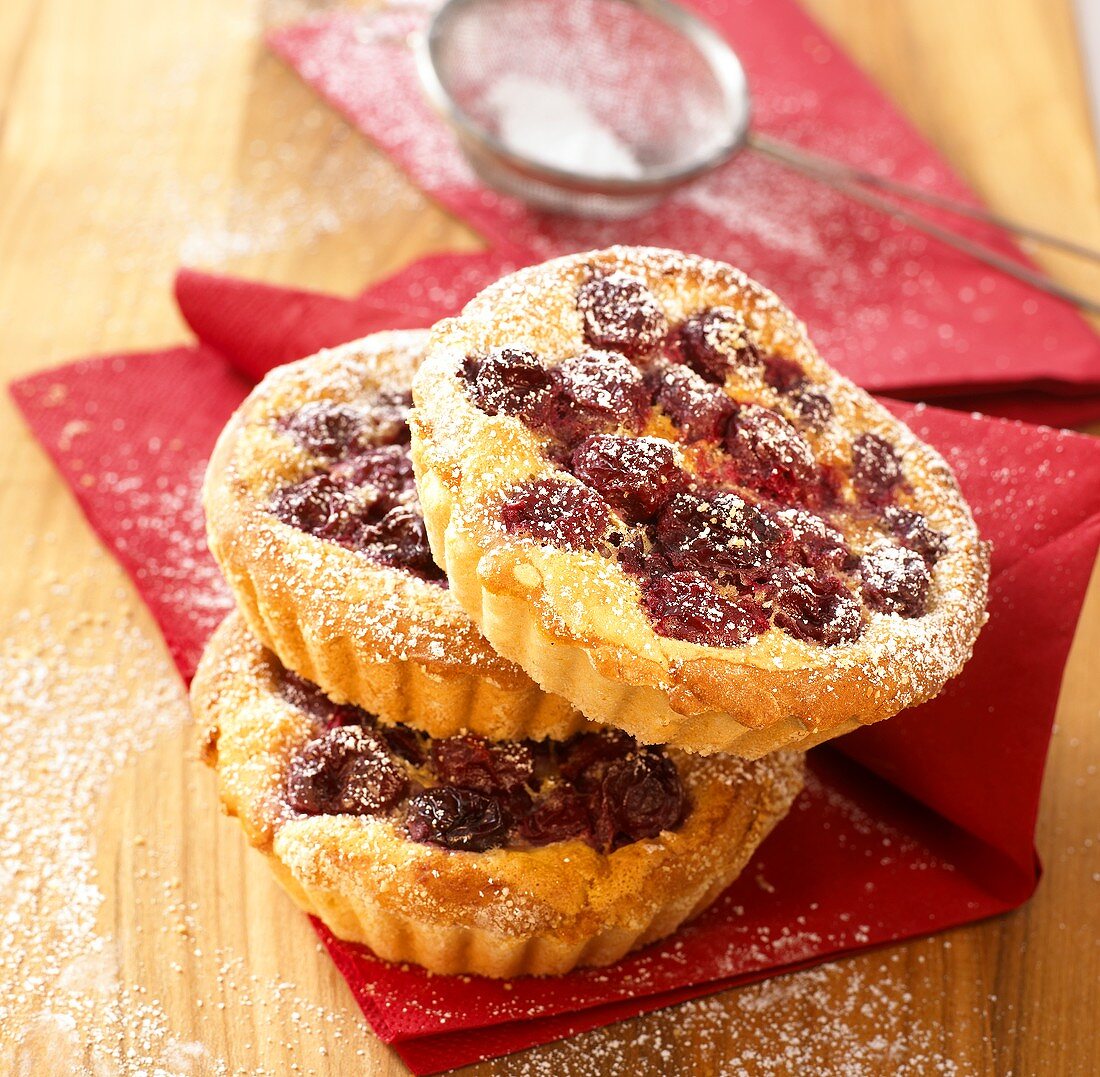 Cherry tarts with icing sugar