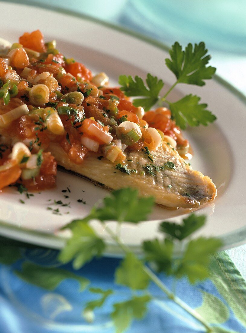 Pike-perch with tomatoes and spring onions
