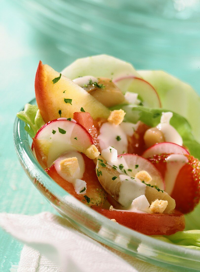 Matje herring salad with peach and strawberries