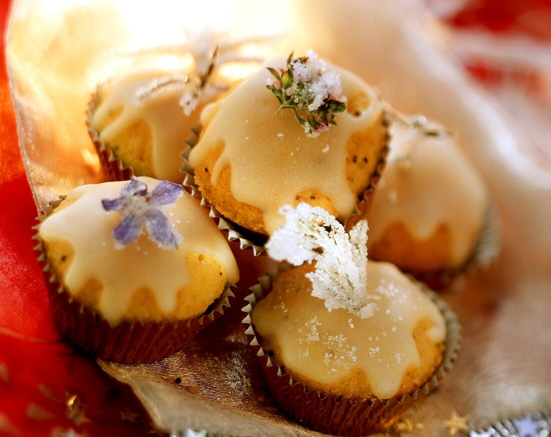 Petit fours with icing and candied flowers