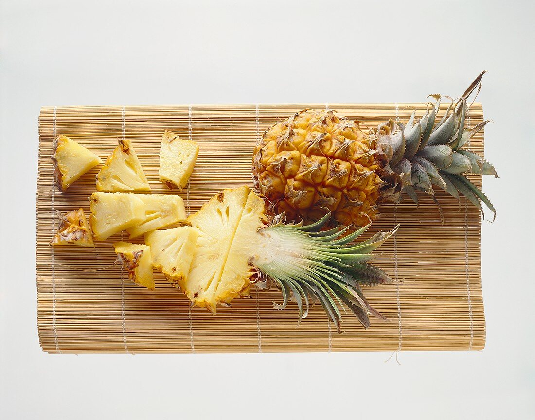 Baby pineapple, half a pineapple & pineapple pieces