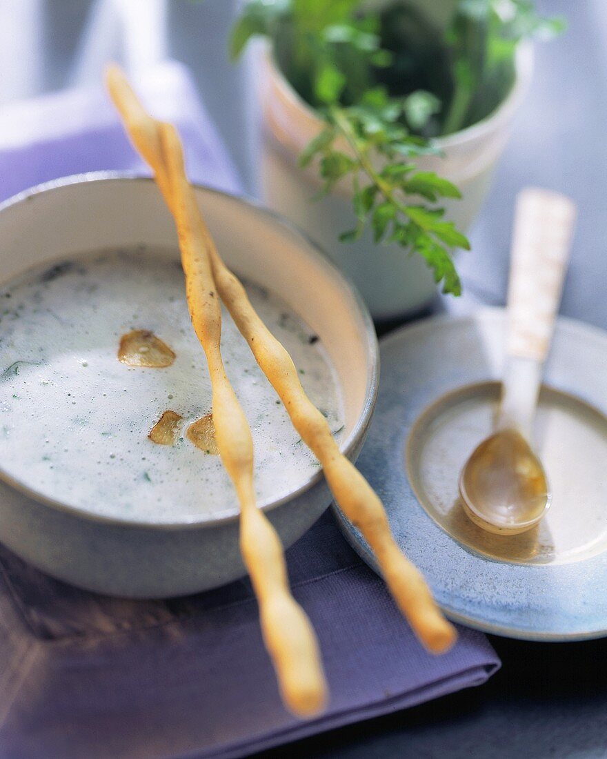 Whipped cream cheese soup with garlic and rocket