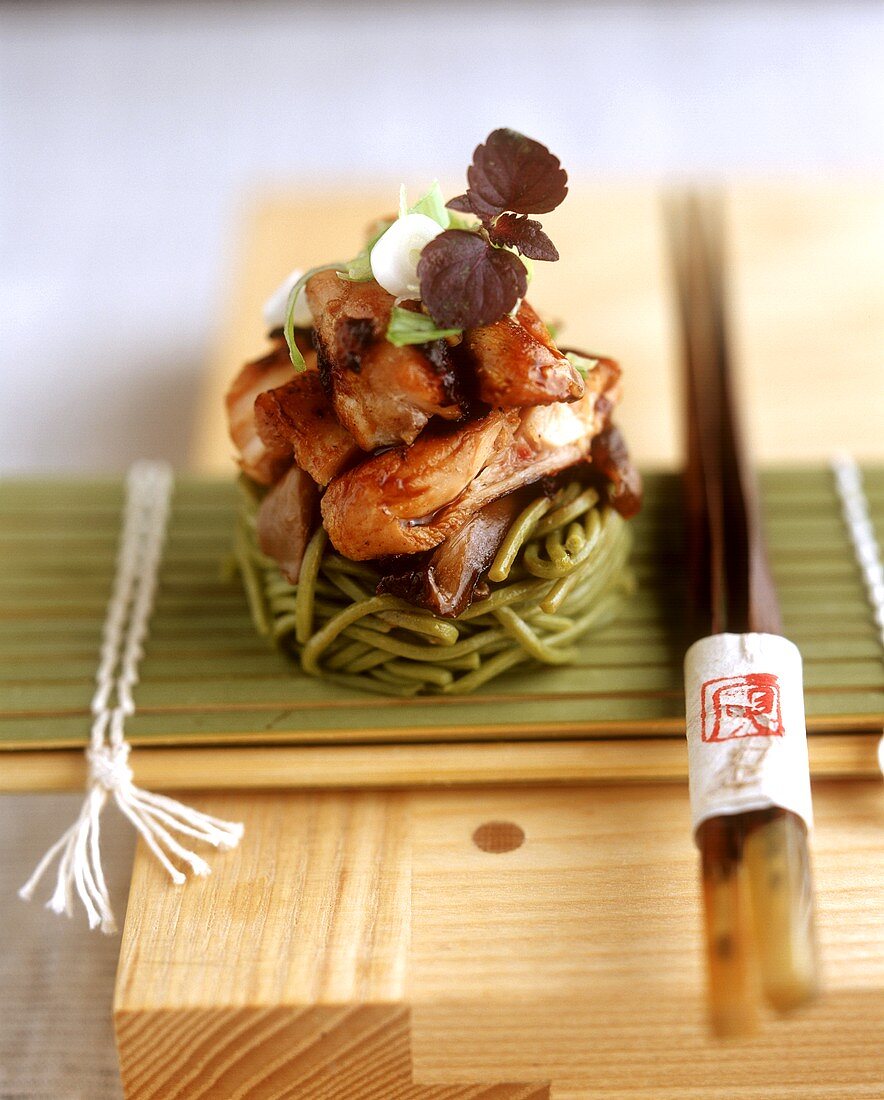 Duck breast strips on green Japanese noodles