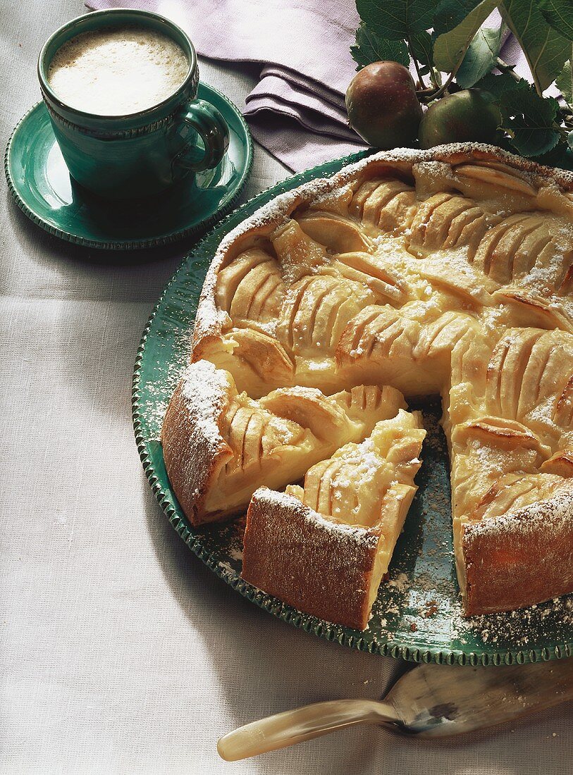 Sunken apple cake and a cup of coffee