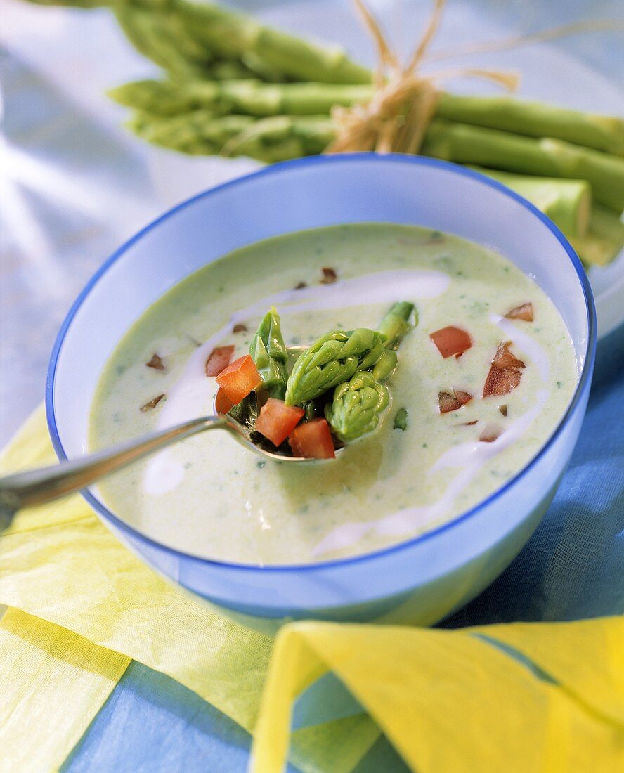 Green asparagus soup with diced tomato