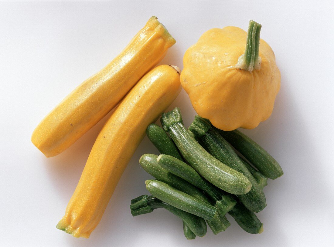 Green and yellow mini-courgettes and mini-patty pan squashes