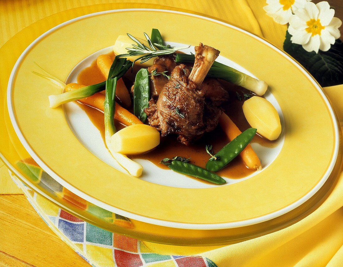 Braised kid with vegetables in lemon and thyme jus