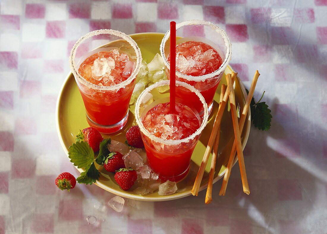 Three glasses of strawberry daiquiri (rum-based cocktail)