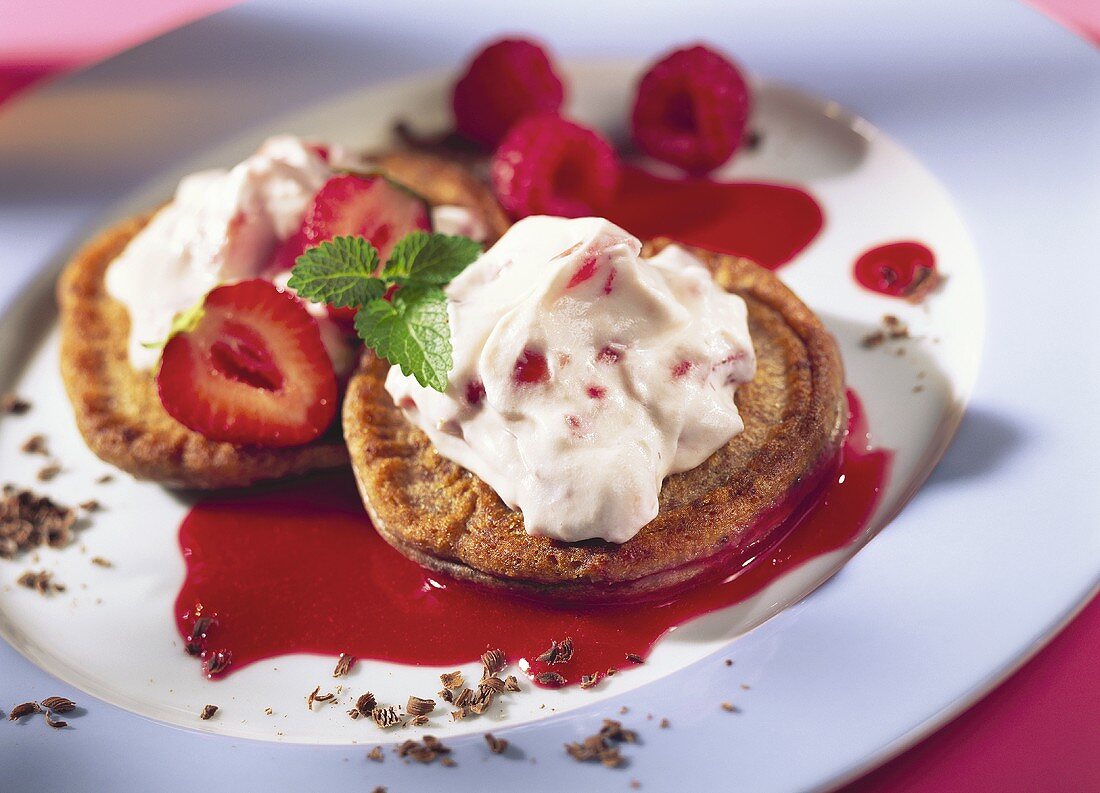 Chocolate buns with strawberry cream