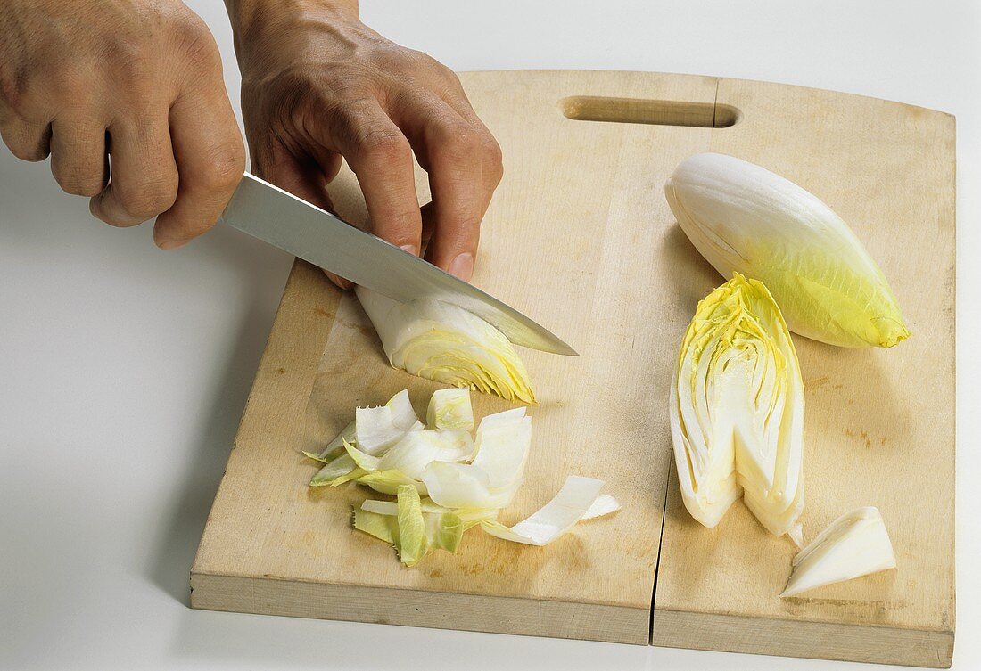 Cutting chicory into strips