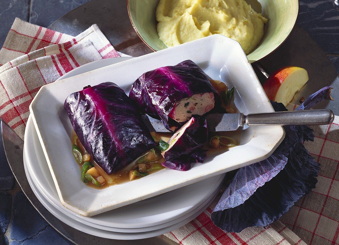 Red cabbage roulade on apple and onion sauce