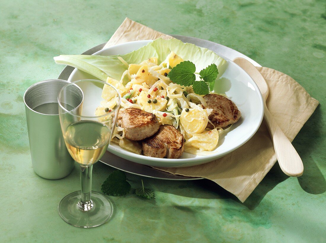Port medallions with pineapple and white cabbage casserole