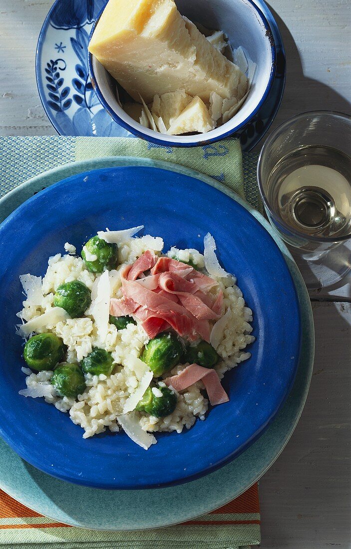 Brussels sprout risotto with strips of ham and Parmesan