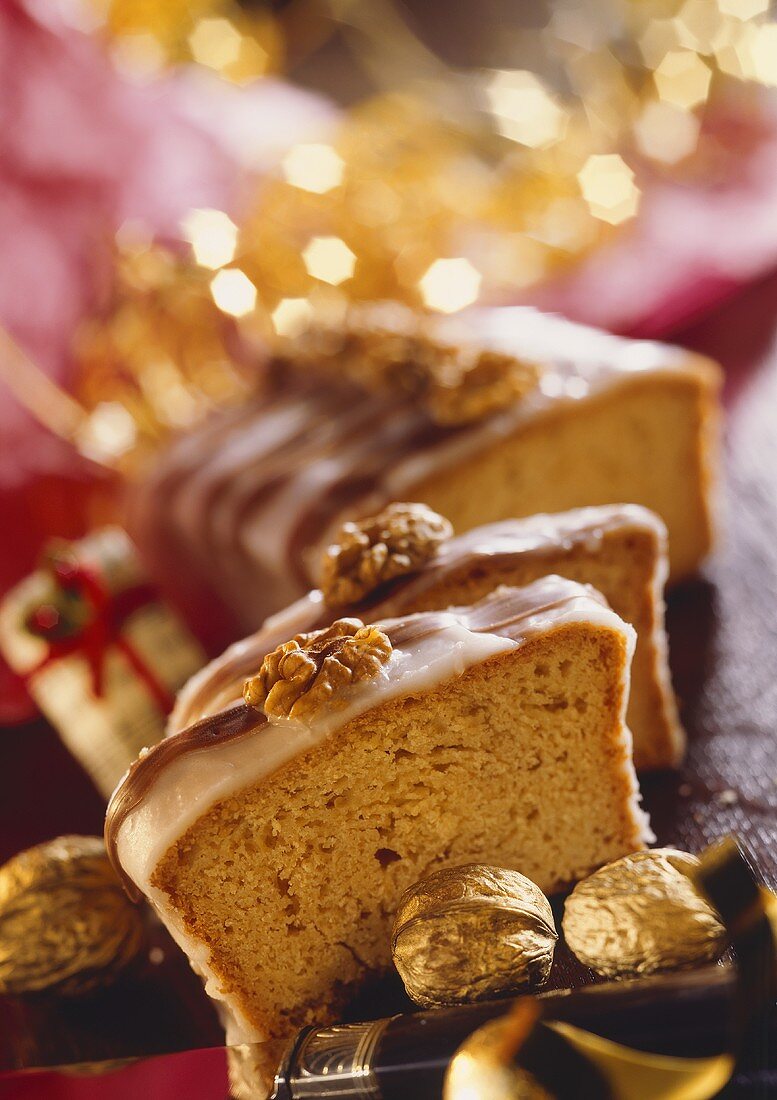 Walnut cake with lemon icing, sliced