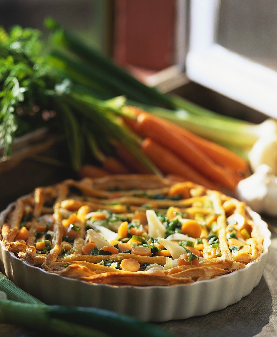 Tart with carrots and spring onions
