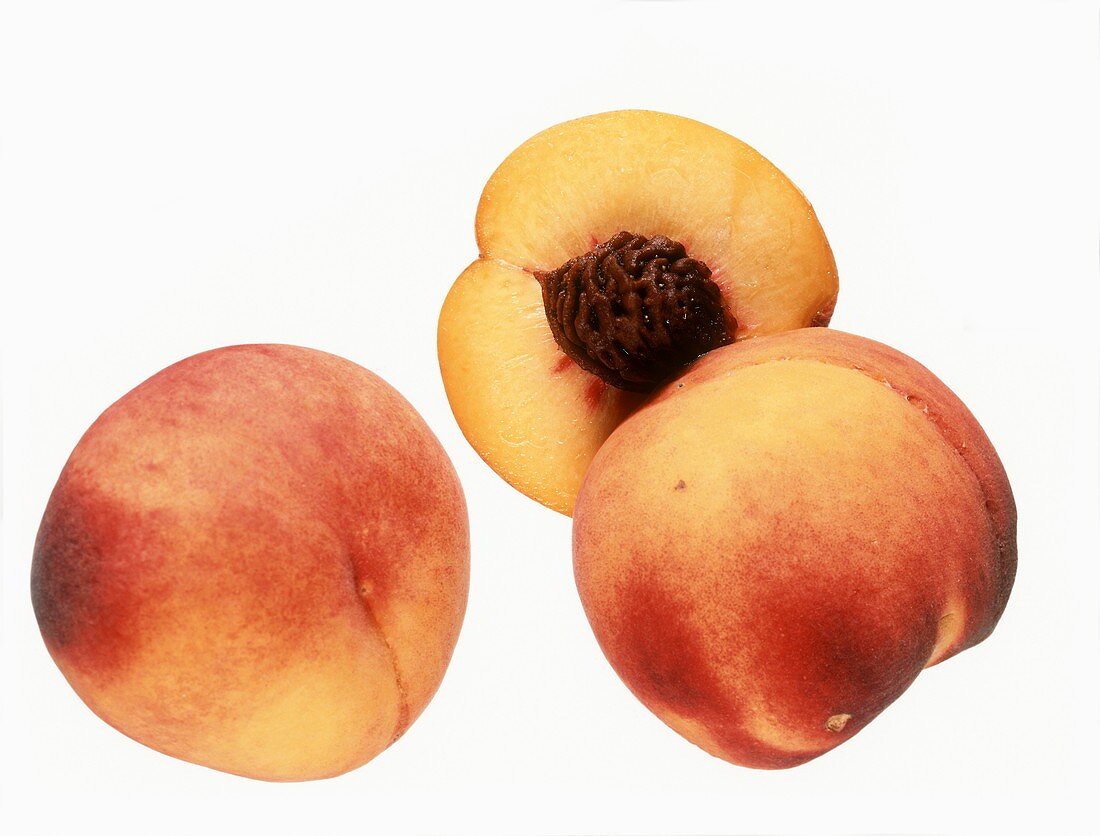 Two whole peaches and half a peach