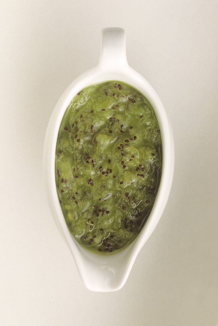 Kiwi fruit sauce in sauce-boat