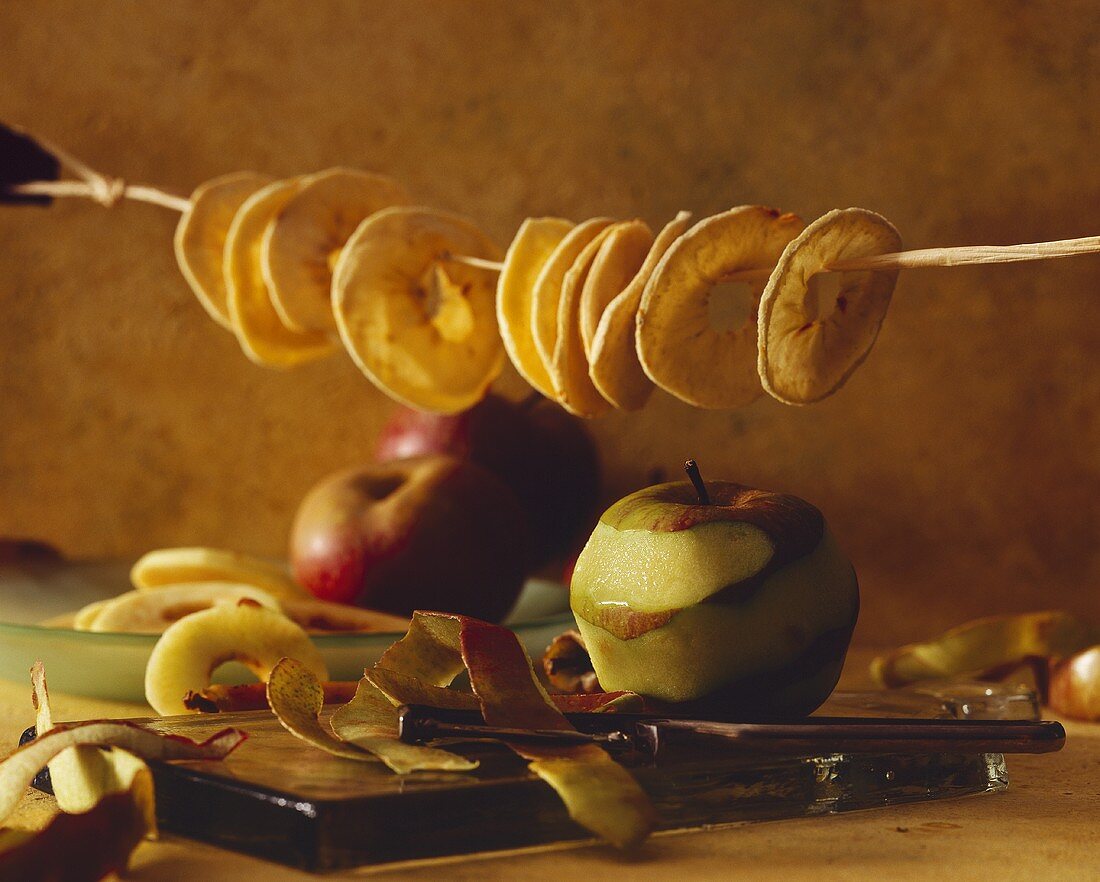 Still life with dried apple rings and apples