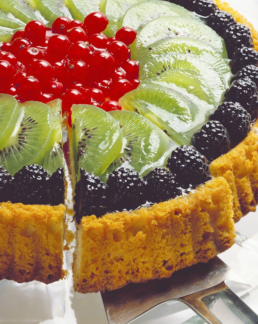 A kiwi fruit flan with berries