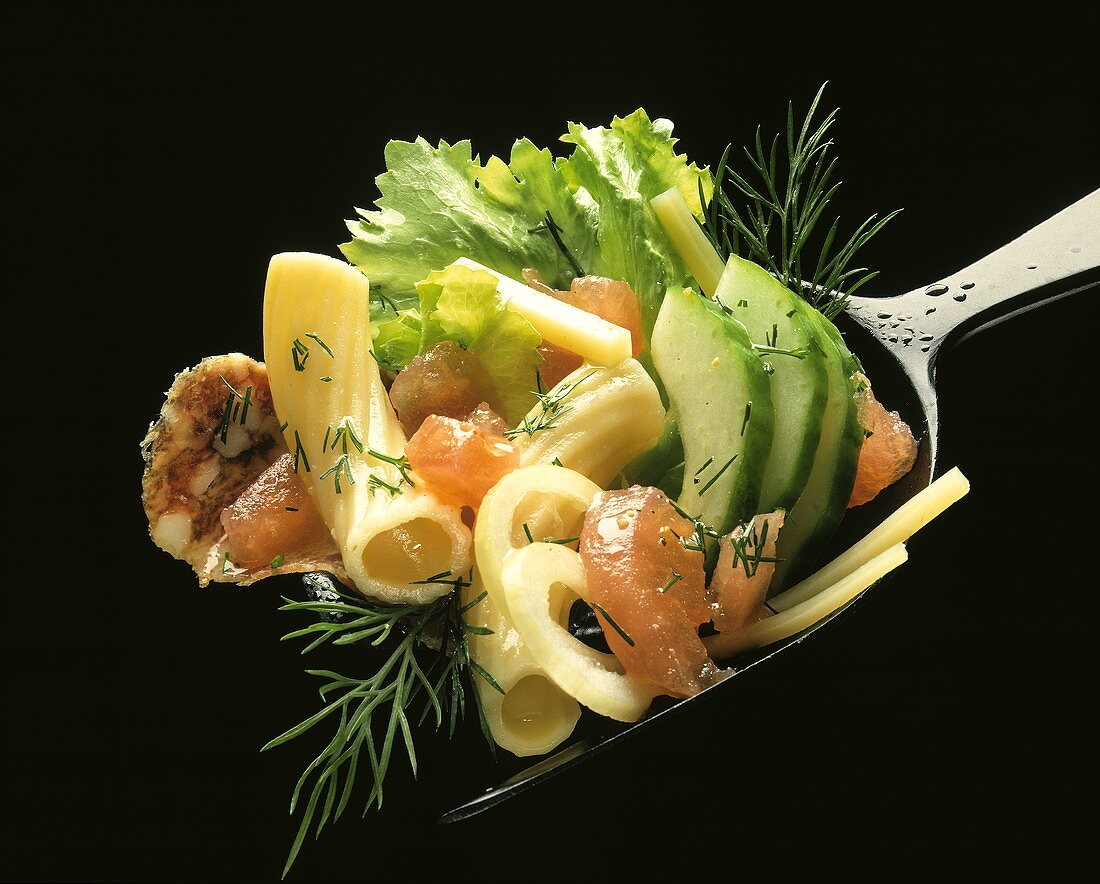 Pasta Salad with Vegetables on a Spoon, Close Up