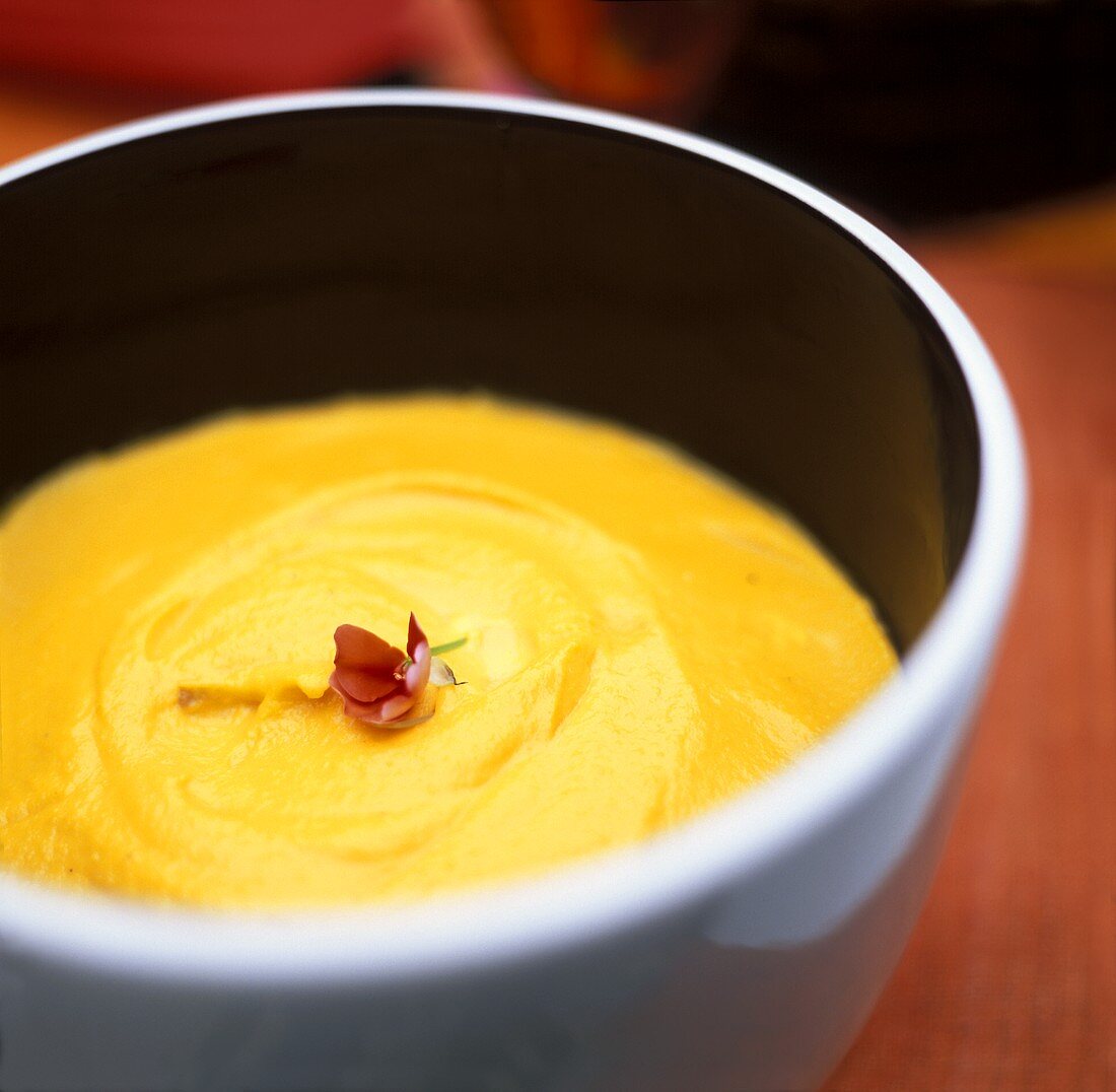Cream of pumpkin soup, decorated with flowers