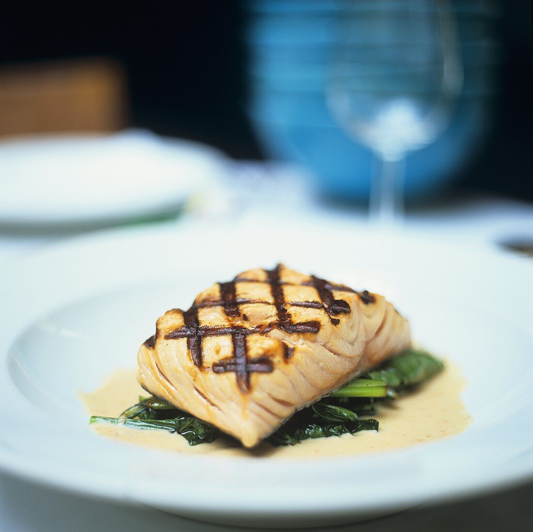 Grilled salmon fillet on spinach