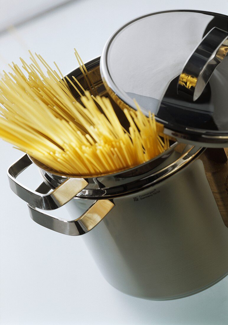 Spaghetti sticking out of a pasta pan
